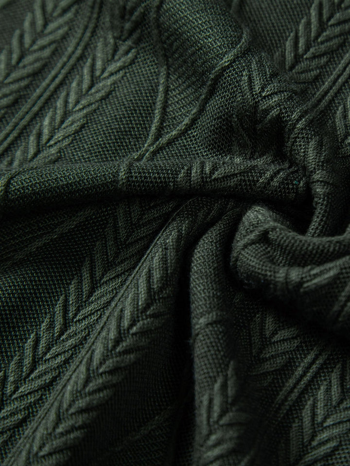August - Geometrisches Plaid gestrickt
